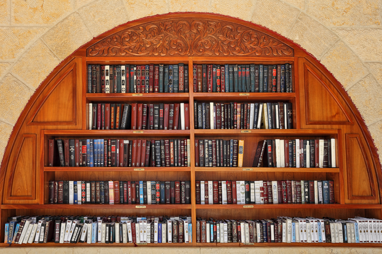 Shelves of books in a semi-circular bookcase
